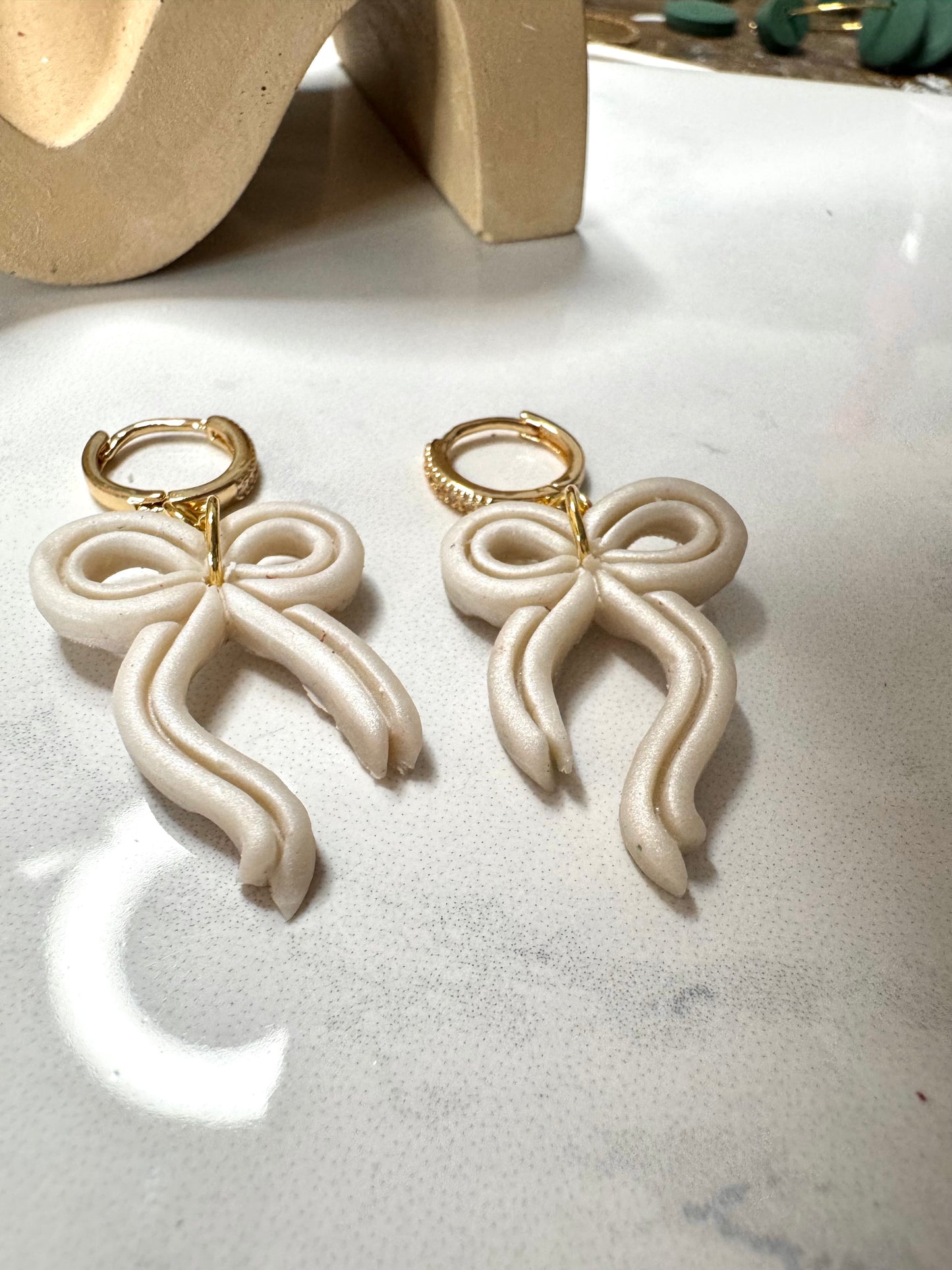 Bow Huggie Hoops- Pearl